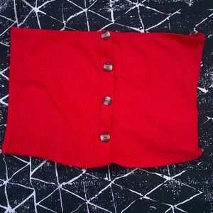 A red tube top with decor bottoms up the front